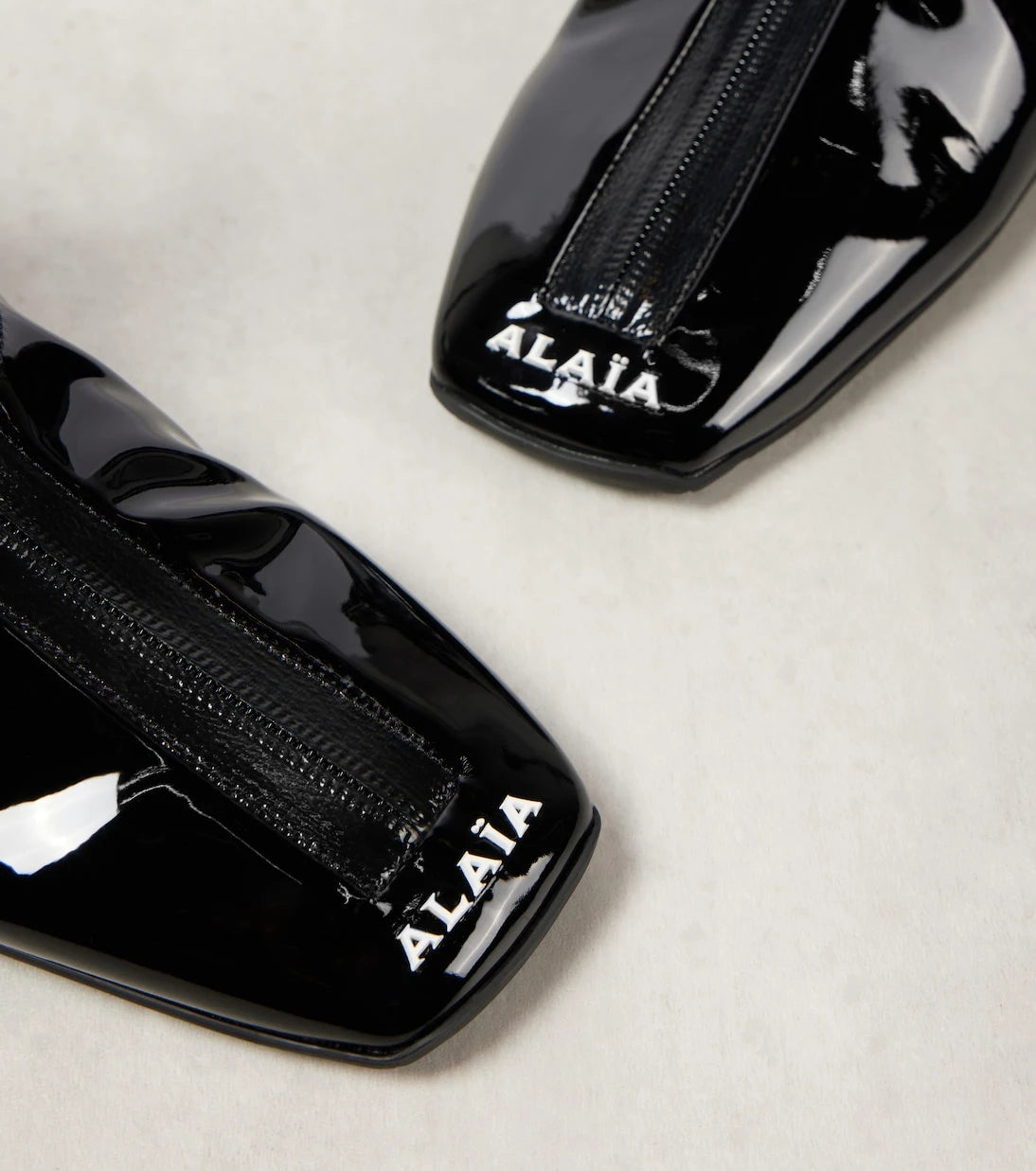 Alaïa - Sneaker faux patent leather ankle boots