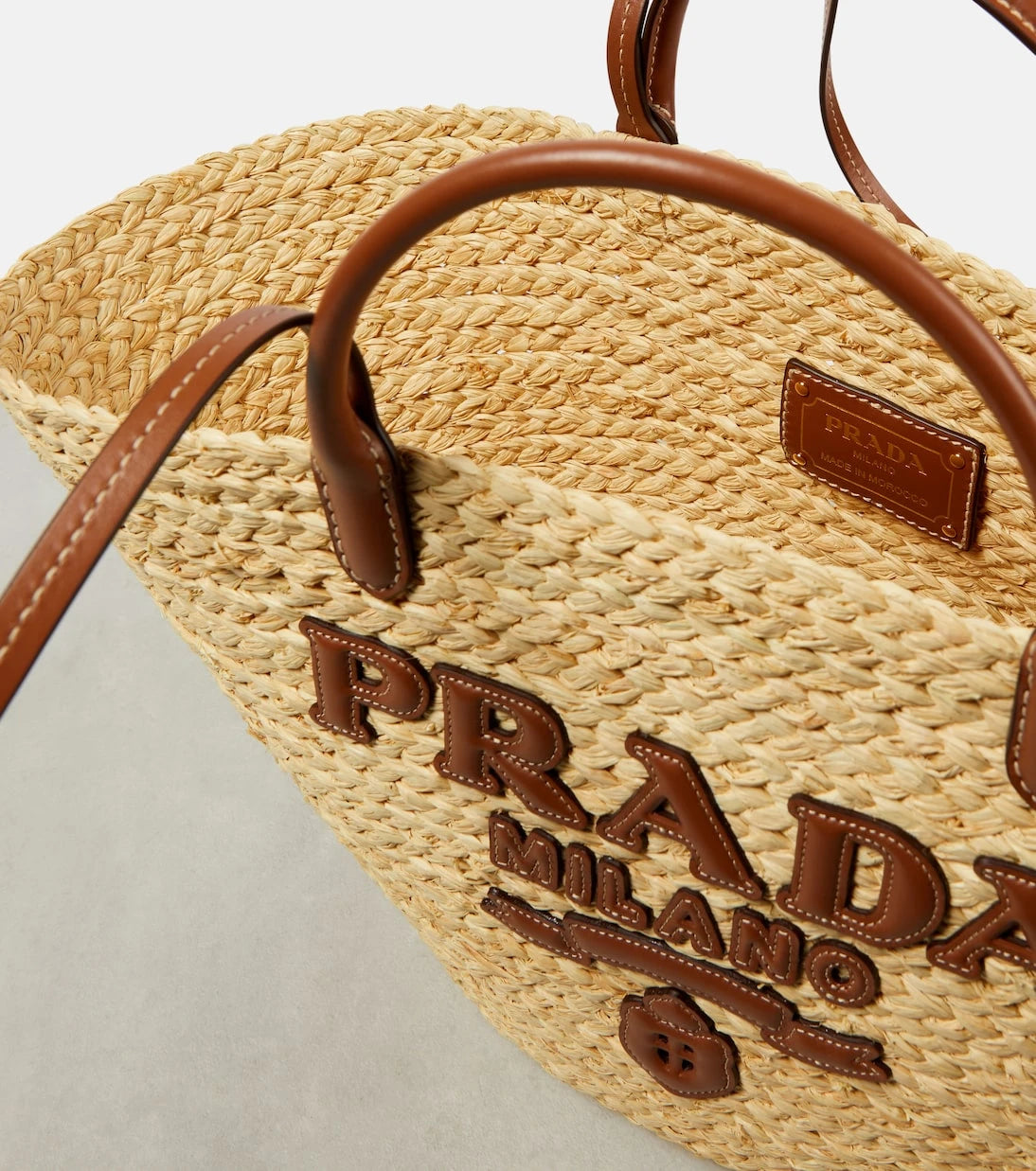 Prada - Logo leather-trimmed raffia basket bag