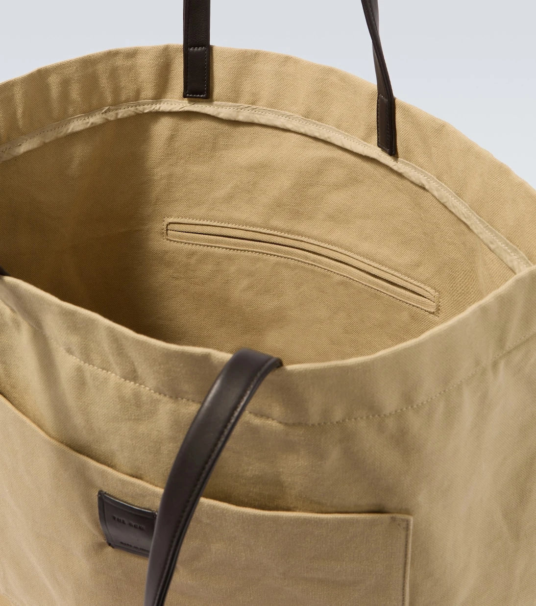 The Row - Tori leather-trimmed canvas tote bag