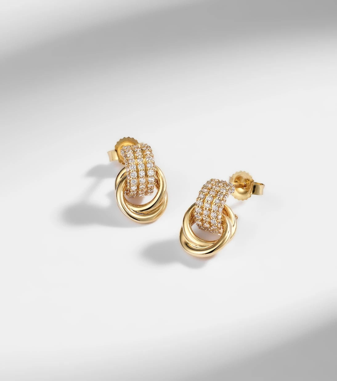 Stone and Strand - Forme Knot 14kt gold earrings with diamonds