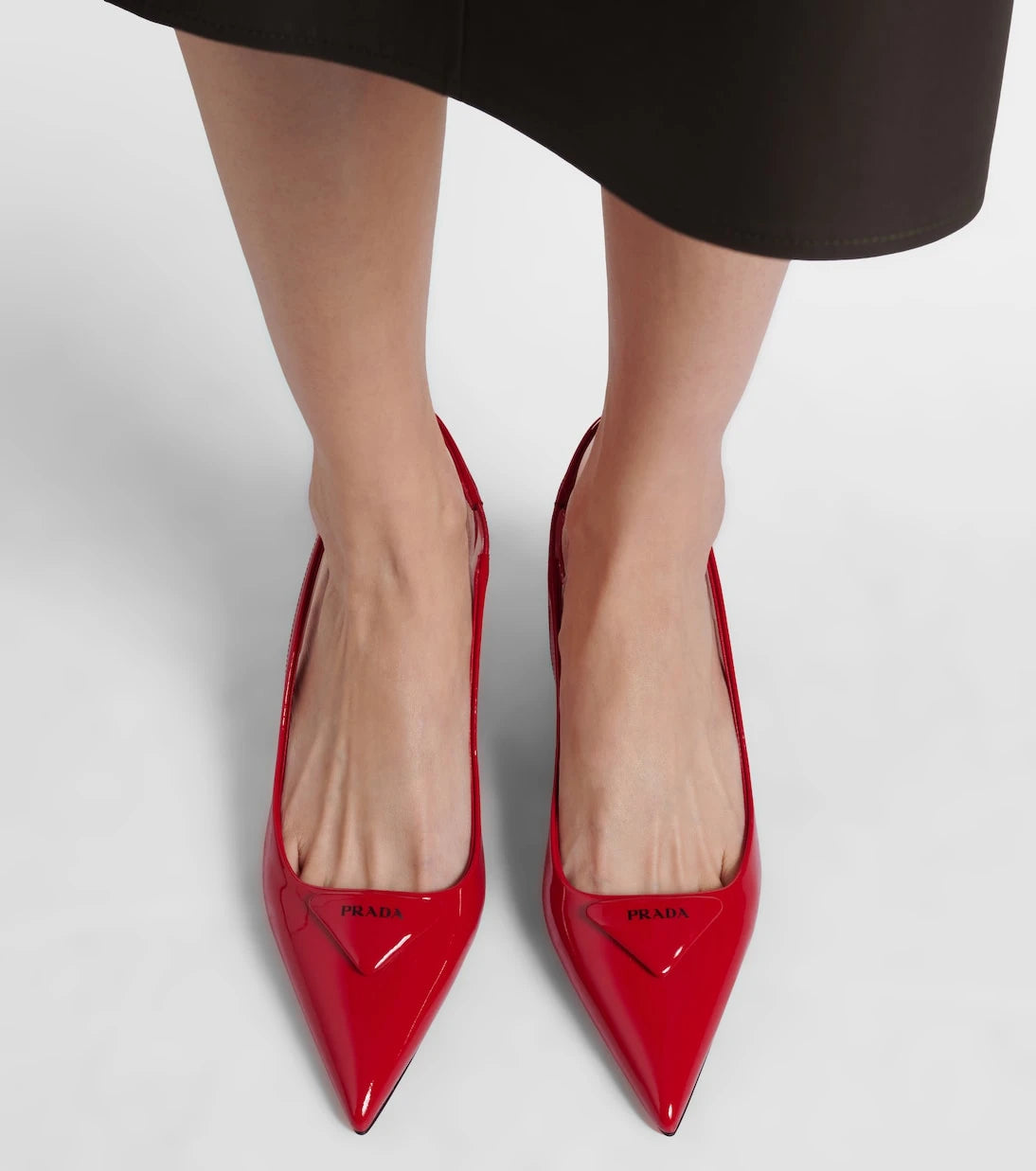 Prada - 55 patent leather slingback pumps