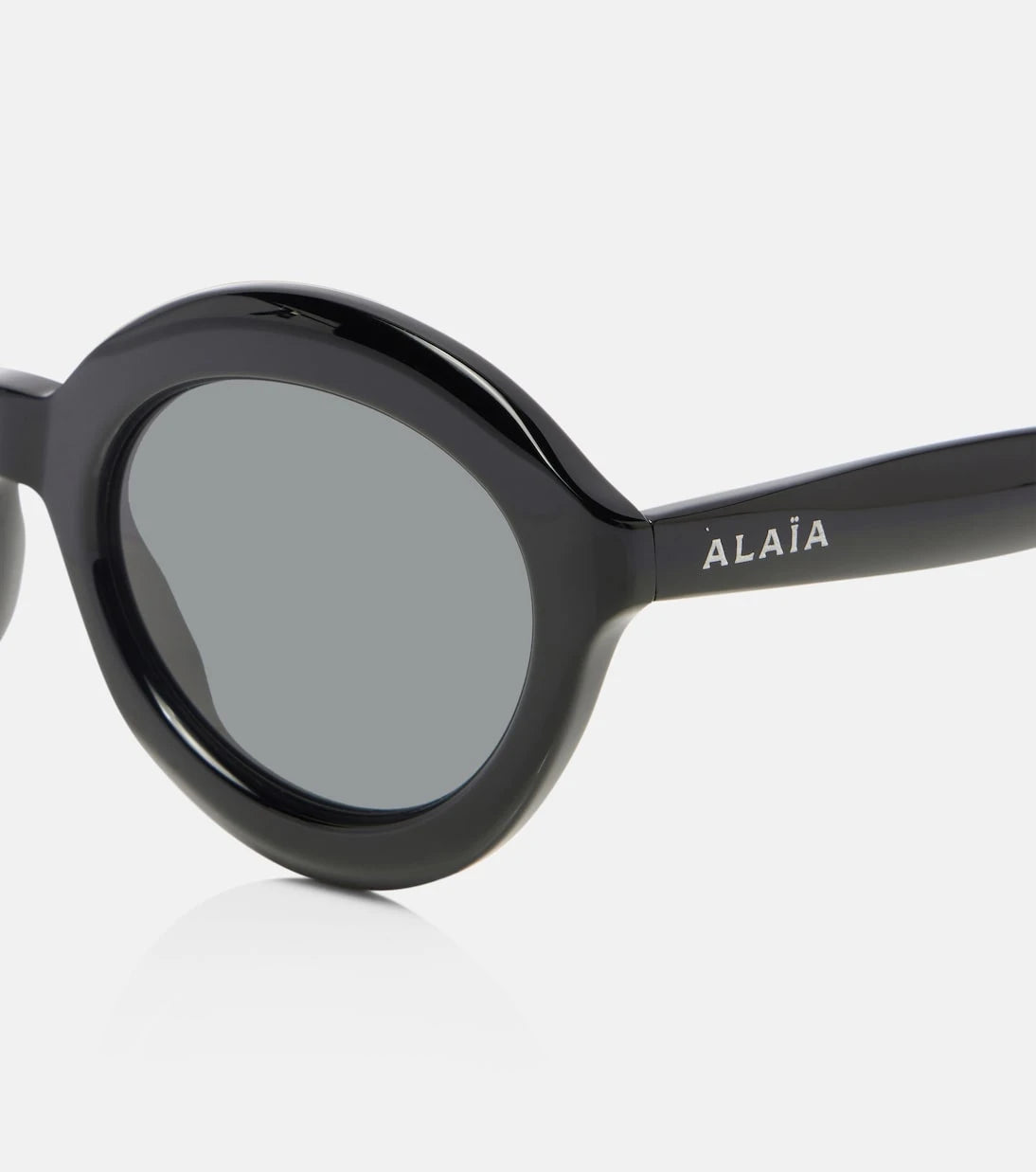 Alaïa - Lettering Logo round sunglasses